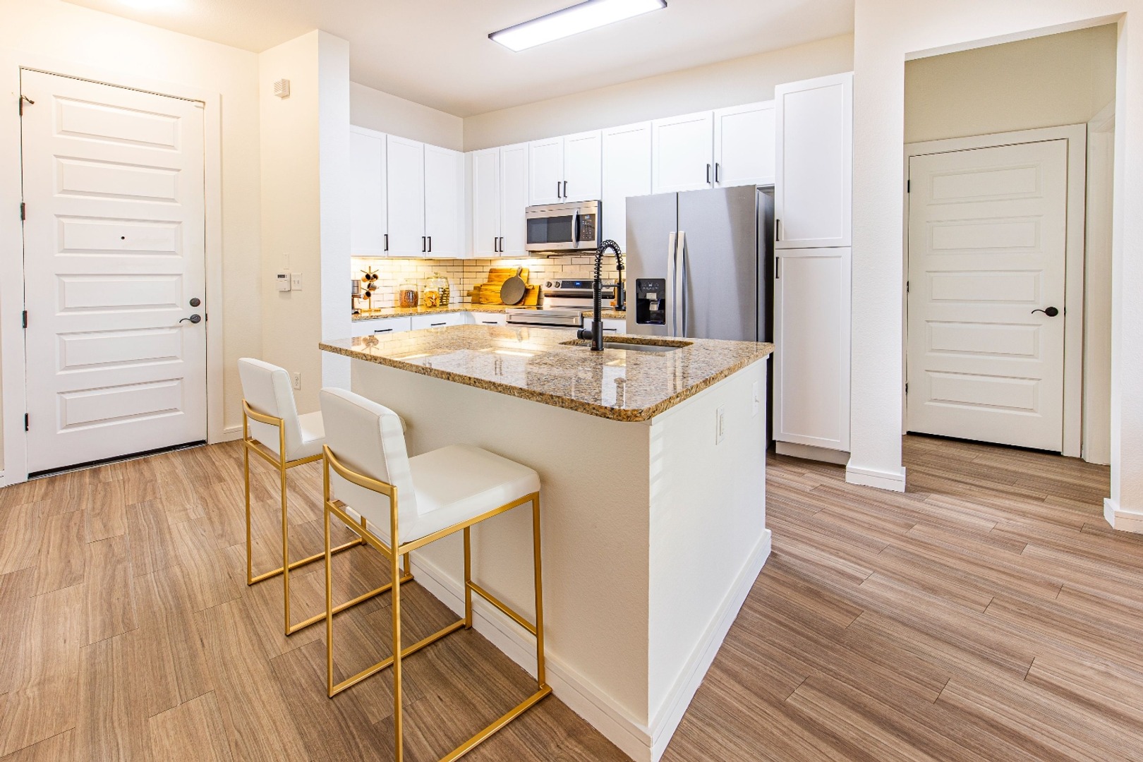 Contemporary kitchen featuring island seating