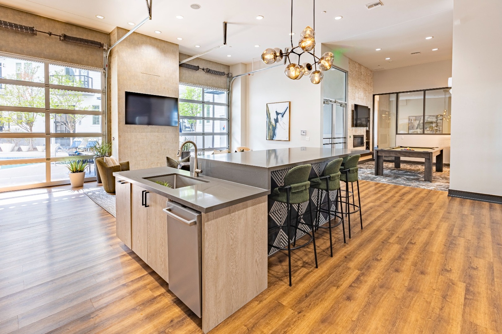 Modern shared kitchen area with countertop space and bar stools