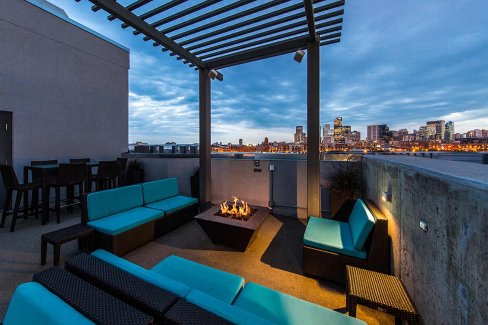 Rooftop firepit area with city skyline views